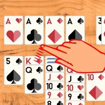 Play Klondike Solitaire: arrange the cards by suit